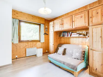 a living room with a couch and a window at Apartment Le Sarto by Interhome in Saint-Gervais-les-Bains