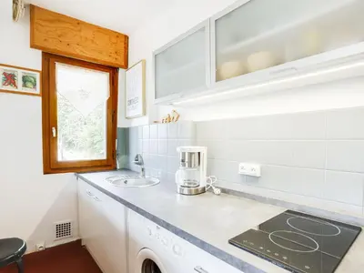 a kitchen with a sink and a counter top at Apartment Le Sarto by Interhome in Saint-Gervais-les-Bains