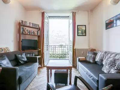 a living room with a couch and a tv at Apartment La Résidence by Interhome in Saint-Gervais-les-Bains