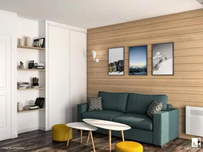 a living room with a couch and a table at maeva Home Résidence la Rivière in Chamonix-Mont-Blanc