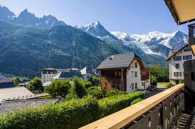 a view of a town with mountains in the background at La Saleina Apartment - Chamonix All Year in Chamonix-Mont-Blanc
