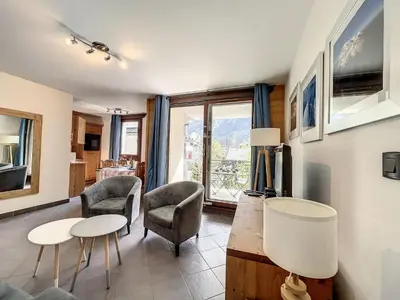 a living room with two chairs and a table at Appartement T3 au Centre de Chamonix avec WIFI et Parking - FR-1-507-3 in Chamonix-Mont-Blanc
