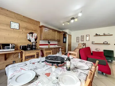 a kitchen with a table with plates and wine glasses at Chamonix centre, 64m², 6 pers., 2 chambres, parking - FR-1-507-14 in Chamonix-Mont-Blanc