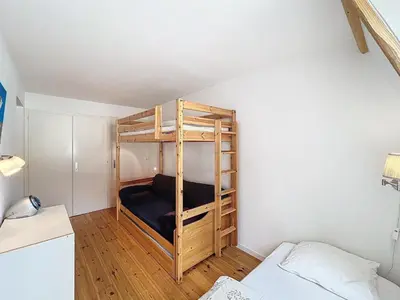 a bedroom with a bunk bed in a room at Chamonix: Appart 4 pers, Parking, Wifi - FR-1-507-24 in Chamonix-Mont-Blanc