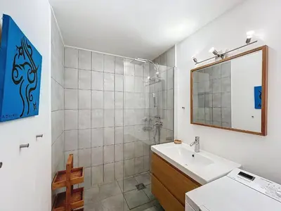 a bathroom with a sink and a shower with a mirror at Chamonix: Appart 4 pers, Parking, Wifi - FR-1-507-24 in Chamonix-Mont-Blanc