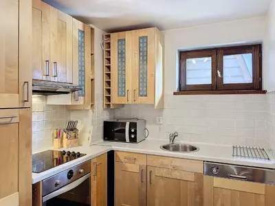 a kitchen with a sink and a microwave at Chamonix: Appart 4 pers, Parking, Wifi - FR-1-507-24 in Chamonix-Mont-Blanc