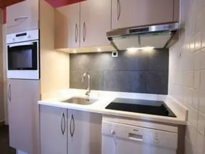 a kitchen with a sink and a stove at Appartement spacieux à Chamonix, 8 pers, ascenseur - FR-1-507-25 in Chamonix-Mont-Blanc
