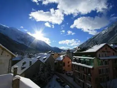 a view of a city with mountains in the background at Appartement spacieux à Chamonix, 8 pers, ascenseur - FR-1-507-25 in Chamonix-Mont-Blanc