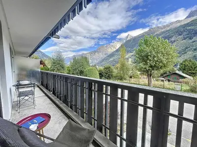 a balcony with a view of a mountain at T2 spacieux 45m² pour 4 pers, centre Chamonix, parking inclus - FR-1-507-27 in Chamonix-Mont-Blanc
