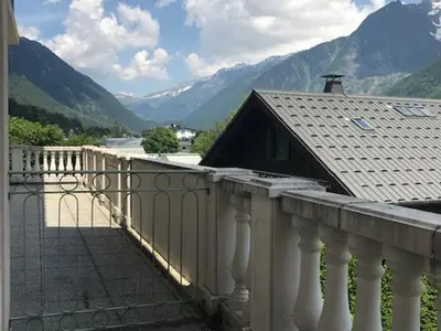 a balcony of a house with a view of mountains at Appartement de standing Chamonix 4 pers, parking/ski - FR-1-507-34 in Chamonix-Mont-Blanc