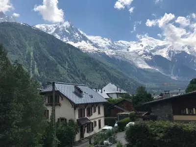 a village with a mountain in the background at Appartement de standing Chamonix 4 pers, parking/ski - FR-1-507-34 in Chamonix-Mont-Blanc