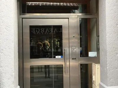 a metal door with a sign on it at Appartement rénové à Chamonix, balcon, parking - FR-1-507-37 in Chamonix-Mont-Blanc