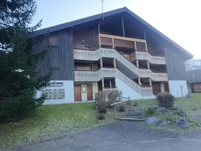 a building with stairs on the side of it at Le Panda in Les Carroz d'Araches