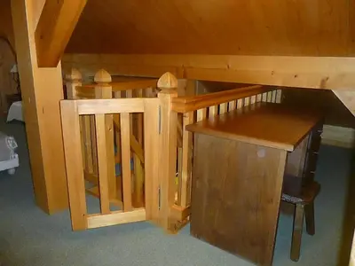 a wooden bunk bed with a desk in a room at Chalet * Lioutraz * in Chamonix-Mont-Blanc