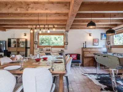 a living room with a table and a pool table at Chalet CLADIE - Private Jacuzzi & Sauna - View of Mont Blanc range - By Cozee Rentals in Les Houches