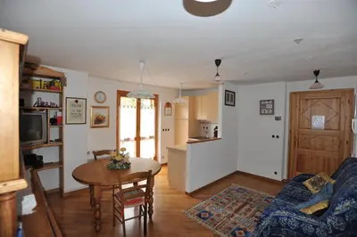 a living room with a couch and a table at Appartement Les Clarines in Les Houches