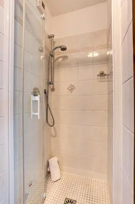 a bathroom with a shower with a glass door at APARTMENT KITSON - Alpes Travel - Chamonix - Sleeps 6 in Chamonix-Mont-Blanc