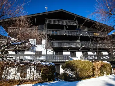 a large building with balconies and snow on the ground at 2 Pièces Vue Mont Blanc avec Balcon - Chamonix, Animaux acceptés - FR-1-517-19 in Chamonix-Mont-Blanc