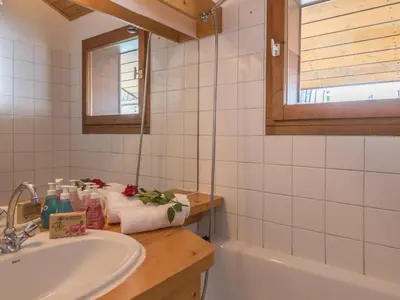 a bathroom with a sink and a bath tub at 2 Pièces à Chamonix, Vue Mont-Blanc, Animaux admis, Parking - FR-1-517-26 in Chamonix-Mont-Blanc