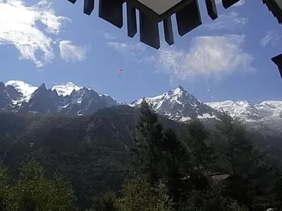 a view of snow capped mountains from a window at Studio lumineux 3 pers, animaux admis, parking - FR-1-517-27 in Chamonix-Mont-Blanc