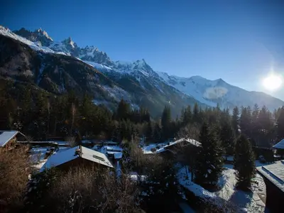 a village in the mountains with snow on the ground at Studio Charmant avec Vue Mont Blanc, Parking et Animaux Admis - FR-1-517-35 in Chamonix-Mont-Blanc