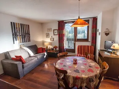 a living room with a couch and a table at Studio Charmant avec Vue Mont Blanc, Parking et Animaux Admis - FR-1-517-35 in Chamonix-Mont-Blanc