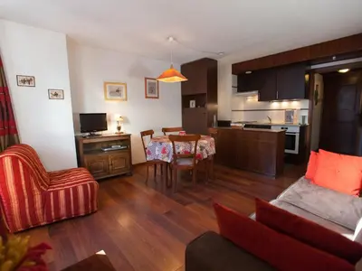a living room and kitchen with a table and chairs at Studio Charmant avec Vue Mont Blanc, Parking et Animaux Admis - FR-1-517-35 in Chamonix-Mont-Blanc