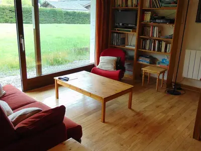 a living room with a couch and a coffee table at Charmant 3 pièces avec terrasse, parking, 6 couchages - Chamonix - FR-1-517-38 in Chamonix-Mont-Blanc