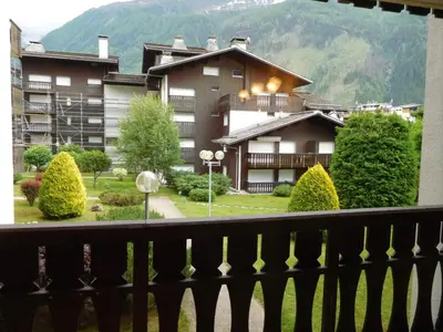 a balcony with a view of a building at Appartement 2 pièces Chamonix avec Parking - FR-1-517-39 in Chamonix-Mont-Blanc