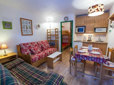 a living room with a couch and a table at Studio Chamonix 20m², 4 pers, balcon, parking - FR-1-517-40 in Chamonix-Mont-Blanc