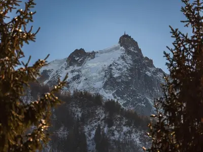 a mountain covered in snow and trees at Studio Chamonix 20m², 4 pers, balcon, parking - FR-1-517-40 in Chamonix-Mont-Blanc