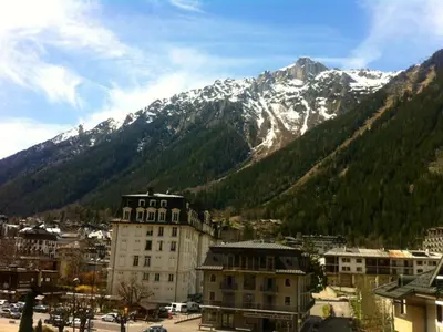 a view of a city with a mountain in the background at Charmant 2 Pièces Central avec Terrasse - Chamonix - FR-1-517-41 in Chamonix-Mont-Blanc