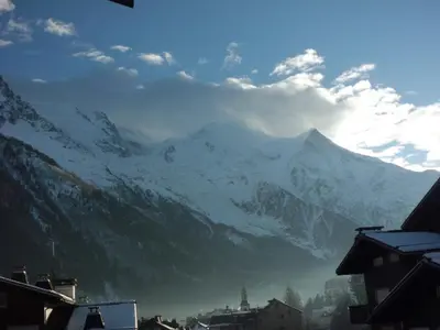 a view of a snow covered mountain from a city at Studio cosy proche des pistes - Animaux admis - FR-1-517-52 in Chamonix-Mont-Blanc