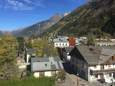 an aerial view of a small town in the mountains at 2 Pièces Sud-Est Chamonix, Parking & Animaux admis - FR-1-517-54 in Chamonix-Mont-Blanc