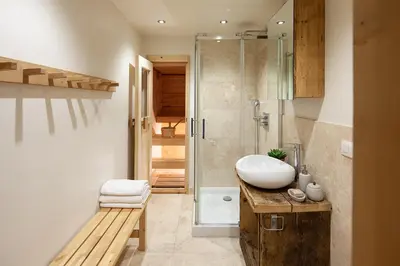 a bathroom with a sink and a shower at Chalet La Chaumière in Chamonix-Mont-Blanc