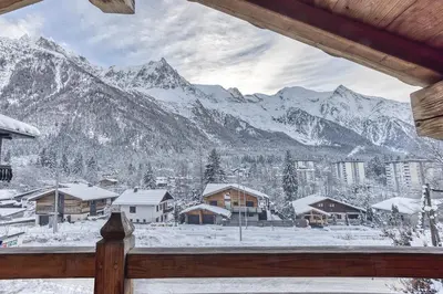 a view of a snowy mountain range from a cabin at Chalet La Chaumière in Chamonix-Mont-Blanc