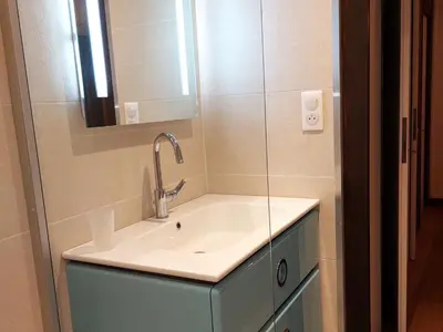 a bathroom with a sink and a mirror at Superbe 3 pièces Chamonix - Jardin privé - Parking - Animaux admis - FR-1-517-25 in Chamonix-Mont-Blanc