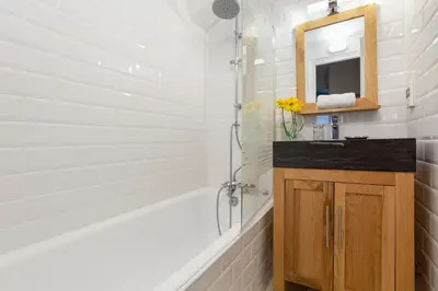 a bathroom with a sink and a mirror at Appartement Lachenal 209A - Happy Rentals in Chamonix-Mont-Blanc
