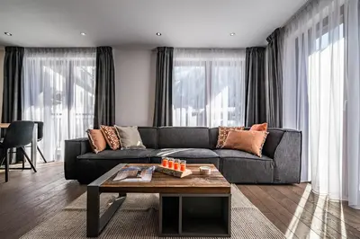 a living room with a couch and a coffee table at Le Globe Argentière Chamonix - by EMERALD STAY in Chamonix-Mont-Blanc