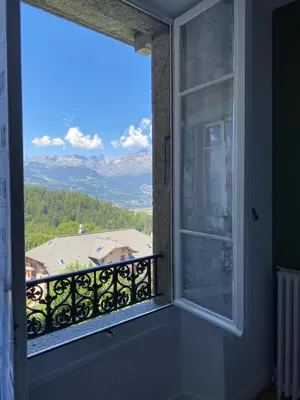 a window with a view of a mountain at Mont Blanc Residence in Saint-Gervais-les-Bains