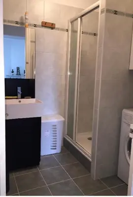 a bathroom with a shower and a sink and a toilet at Mont Blanc Residence in Saint-Gervais-les-Bains