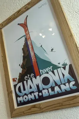 a sign hanging on a wall with a sign that reads be clawmonkey mount blame at APARTMENT ENSA - Alpes Travel - Central Chamonix - Sleeps 4 in Chamonix-Mont-Blanc