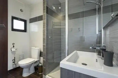 a bathroom with a toilet and a sink and a shower at APARTMENT BEAUSITE - Alpes Travel - Central Chamonix - Sleeps 2-4 in Chamonix-Mont-Blanc