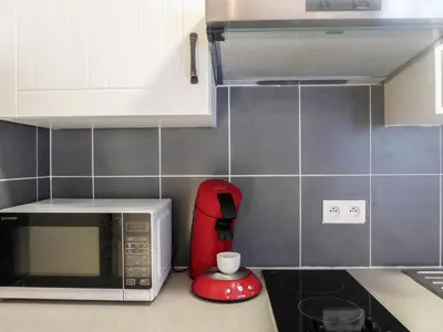 a kitchen with a microwave and a red blender at Studio L'Aiguille du Midi-8 by Interhome in Chamonix-Mont-Blanc