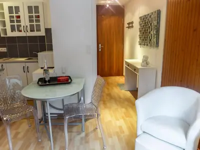 a kitchen and dining room with a table and chairs at Studio L'Aiguille du Midi-8 by Interhome in Chamonix-Mont-Blanc