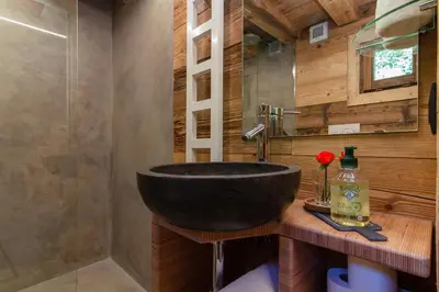a bathroom with a black sink and a mirror at Mazot du Mont-Blanc - Happy Rentals in Chamonix-Mont-Blanc