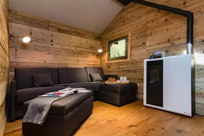 a living room with a couch and a tv at Mazot du Mont-Blanc - Happy Rentals in Chamonix-Mont-Blanc