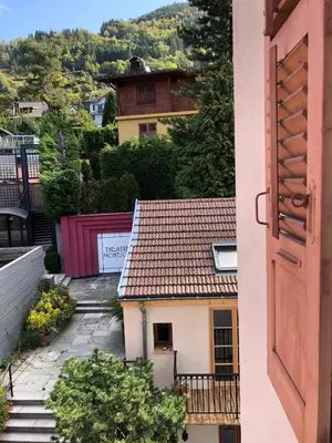 a view from an open door of a house at Le Studio Alpin - Hyper centre Saint Gervais in Saint-Gervais-les-Bains