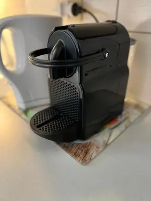 a black coffee maker sitting on a counter at Le Studio Alpin - Hyper centre Saint Gervais in Saint-Gervais-les-Bains