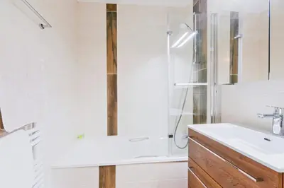 a bathroom with a shower and a sink at Appartement Very - Welkeys in Sallanches